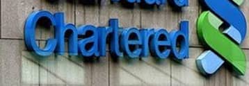 Standard Chartered’s First-half Pre-tax Profit Drops