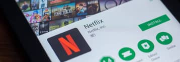 Should I invest in Netflix (NFLX) stock after disappointing subscriber adds and guidance?