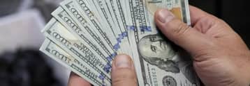 US dollar slips from recent highs as market focus shifts to inflation data