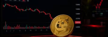 Dogecoin scende per il terzo giorno mentre il supporto a $0.07 inizia a incrinarsi