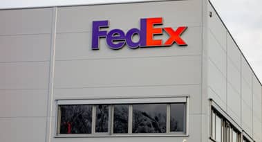 Is FedEx stock a buy or sell after issuing a profit warning?