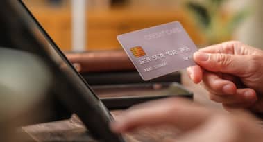 American Express surpasses EPS forecasts and raises guidance, yet shares fall