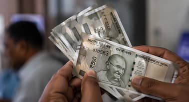 Rupee ticks up, but elevated oil prices restrict gains
