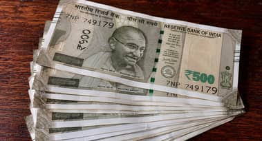 Rupee hits record low as oil surge strains finances