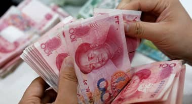 Yuan gains momentum as global banks revise forecasts higher