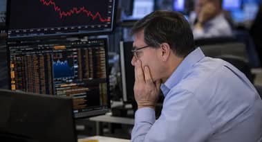 UK equities hover at three-week lows as investors assess global risks