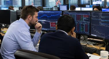 UK stocks edge higher as mining and financial shares lift FTSE 100