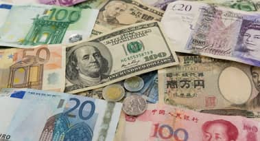 Global currencies trade in narrow ranges as markets focus on inflation and oil
