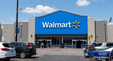 Why is Walmart stock falling 7% despite earnings beat and raised outlook?
